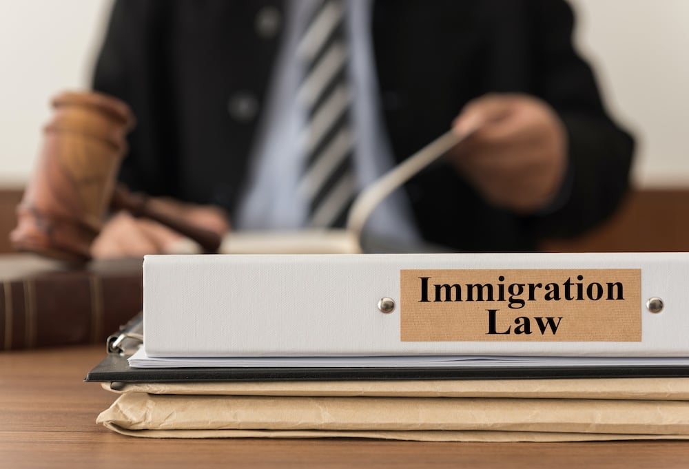 immigration lawyer sitting at a desk