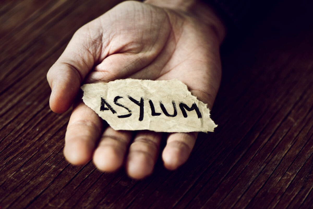 asylum paper hand